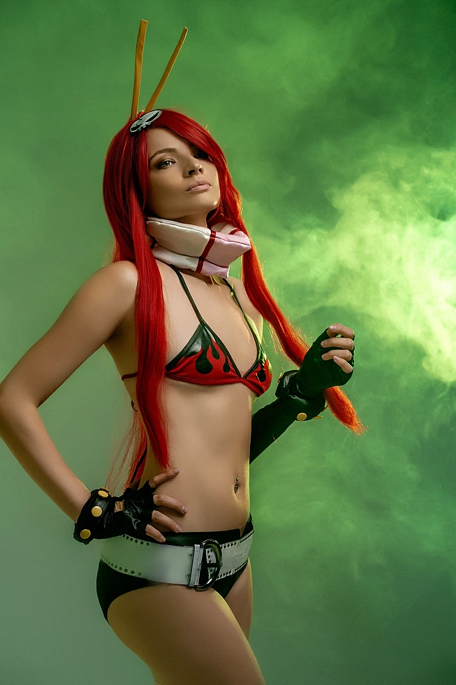 Anime bikini cosplay girl with red hair, green smoke studio, flame top, confident stance, glowing skin, stylized lighting